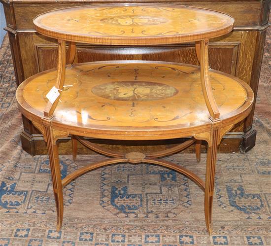 An Edwardian Sheraton style banded and inlaid oval two-tier etagere, on tapered swept supports united by saltire stretcher W.90cm